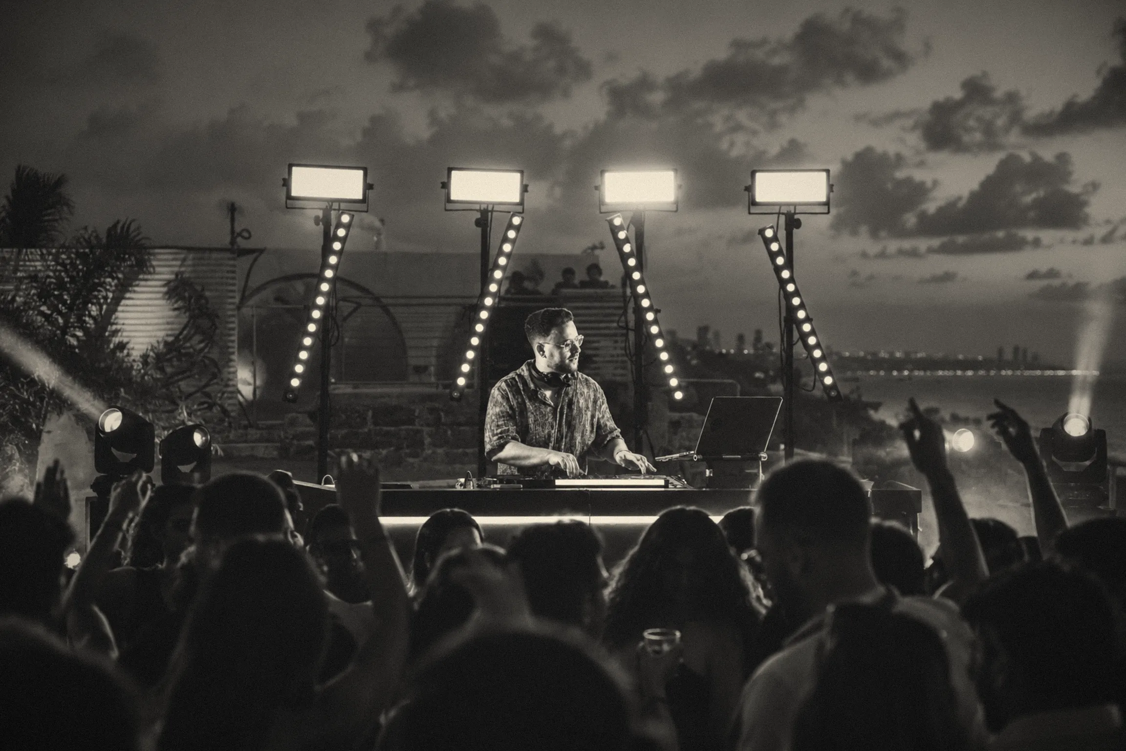 Dor Gal performing at sunset in front of a dancing crowd